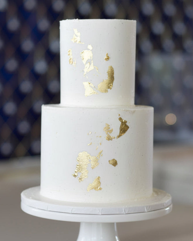 2 tiered clean cake with gold leaf